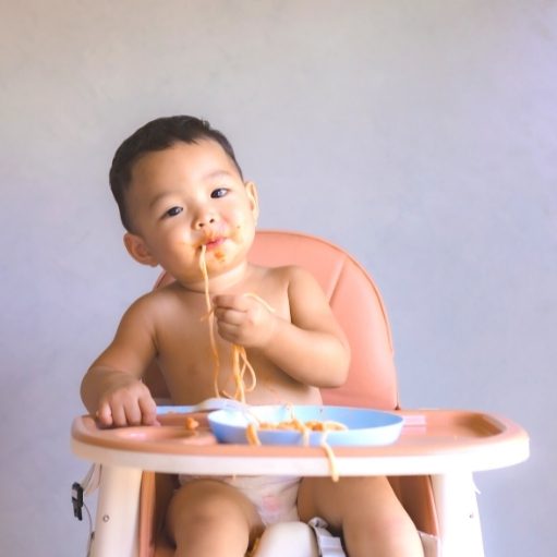 baby sit in a high chair and eat solid foods