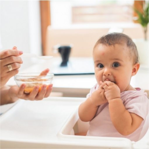 Baby being introduced to some allergenic foods at four months