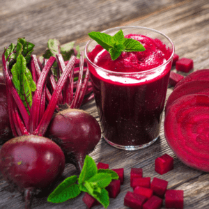 Main image for the article [Learning To Like: Beets!]. Pictured is a beet smoothie, some whole beets and some beets cut into cubes. 