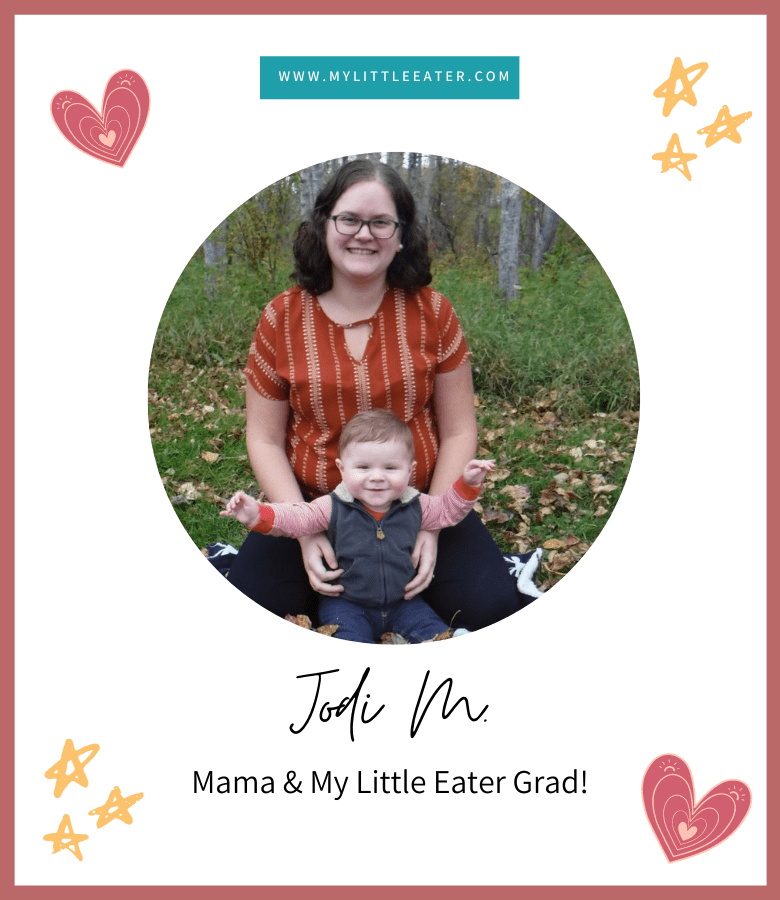Centered in the image is a picture of a mom and her little boy, approx. 1 year old, sitting on a blanket outside on the grass. Surrounding the image are stars and hearts. The image has a maroon border.