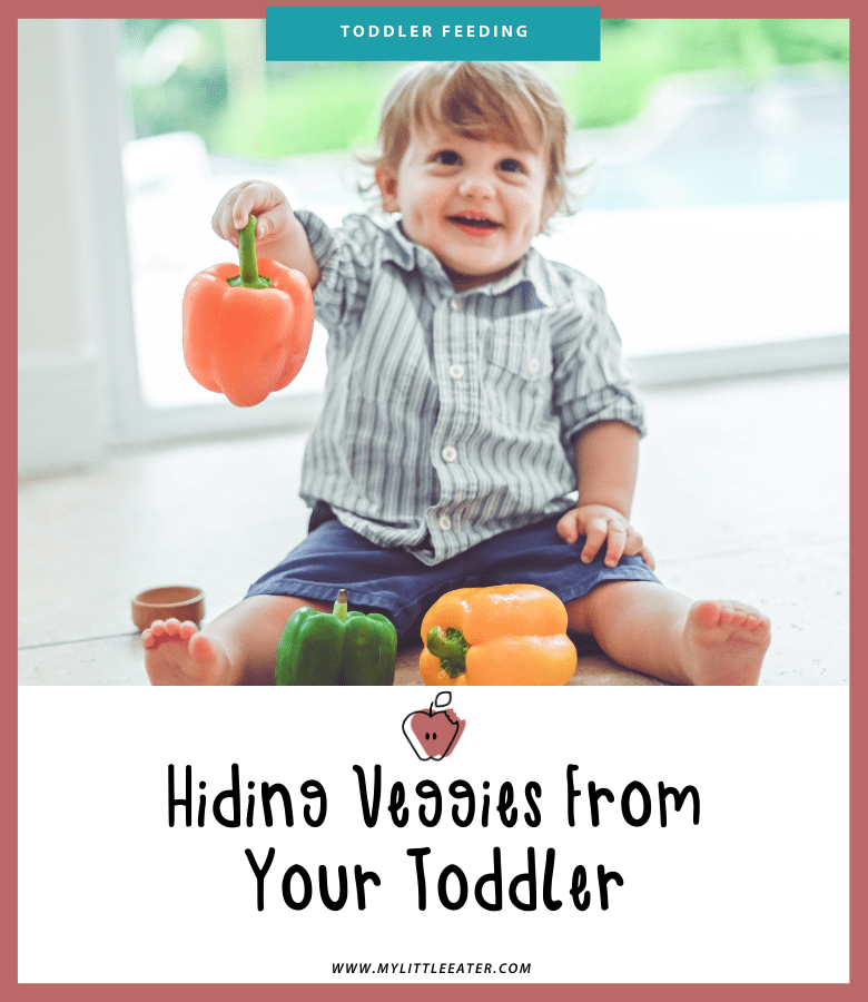 A young toddler is shown sitting on the floor playing with 3 peppers. The title of the article "Hiding Veggies from your Toddler" is seen below.