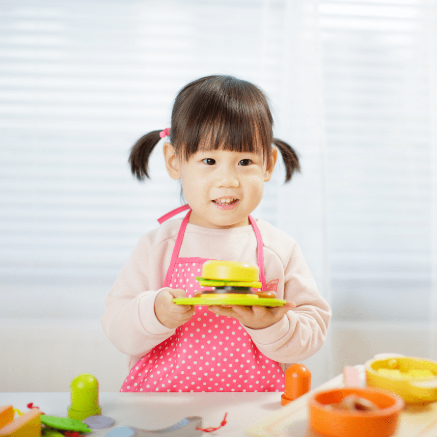 Episode art for episode: "Bonus: Get your toddler to eat MEAT with these 5 FOOD PLAY IDEAS!". Pictured is a toddler playing with toy food.