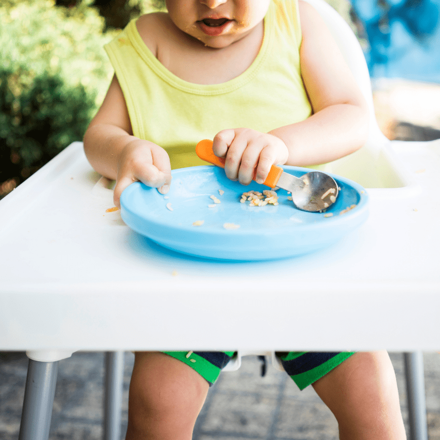 toddler at highchair to eat dinner