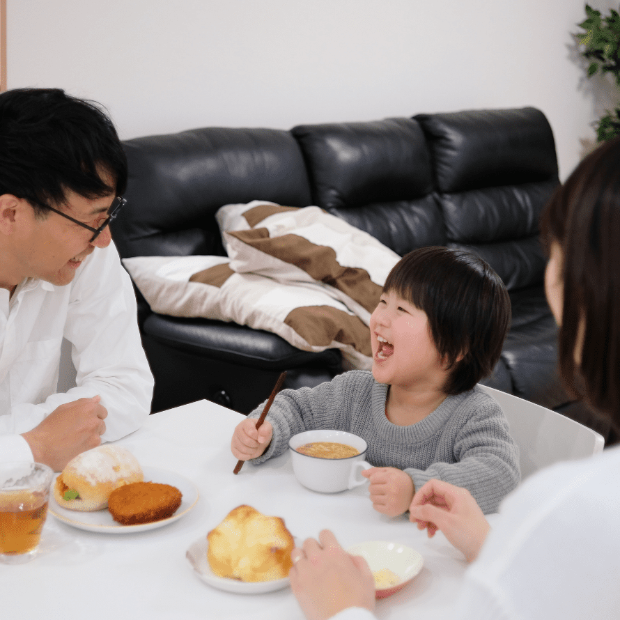 child eating healthy food with parents