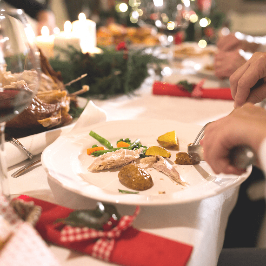 Child eating turkey, vegetables and potatoes at holiday dinner