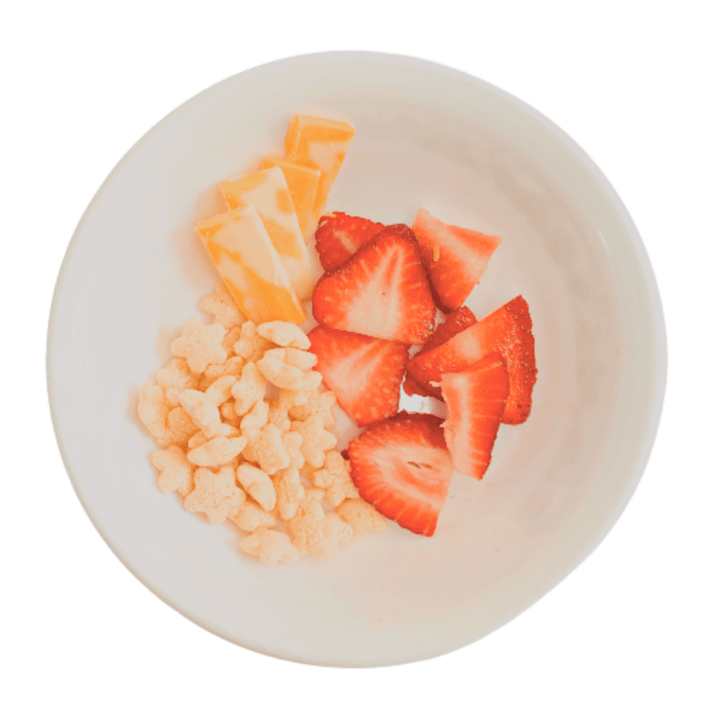 sliced cheese for baby with strawberries and puffs; snack for baby
