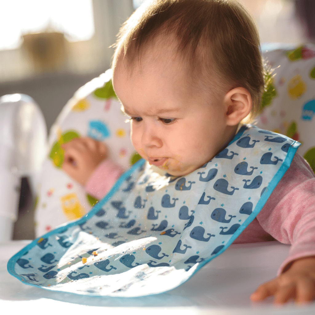baby spits out food