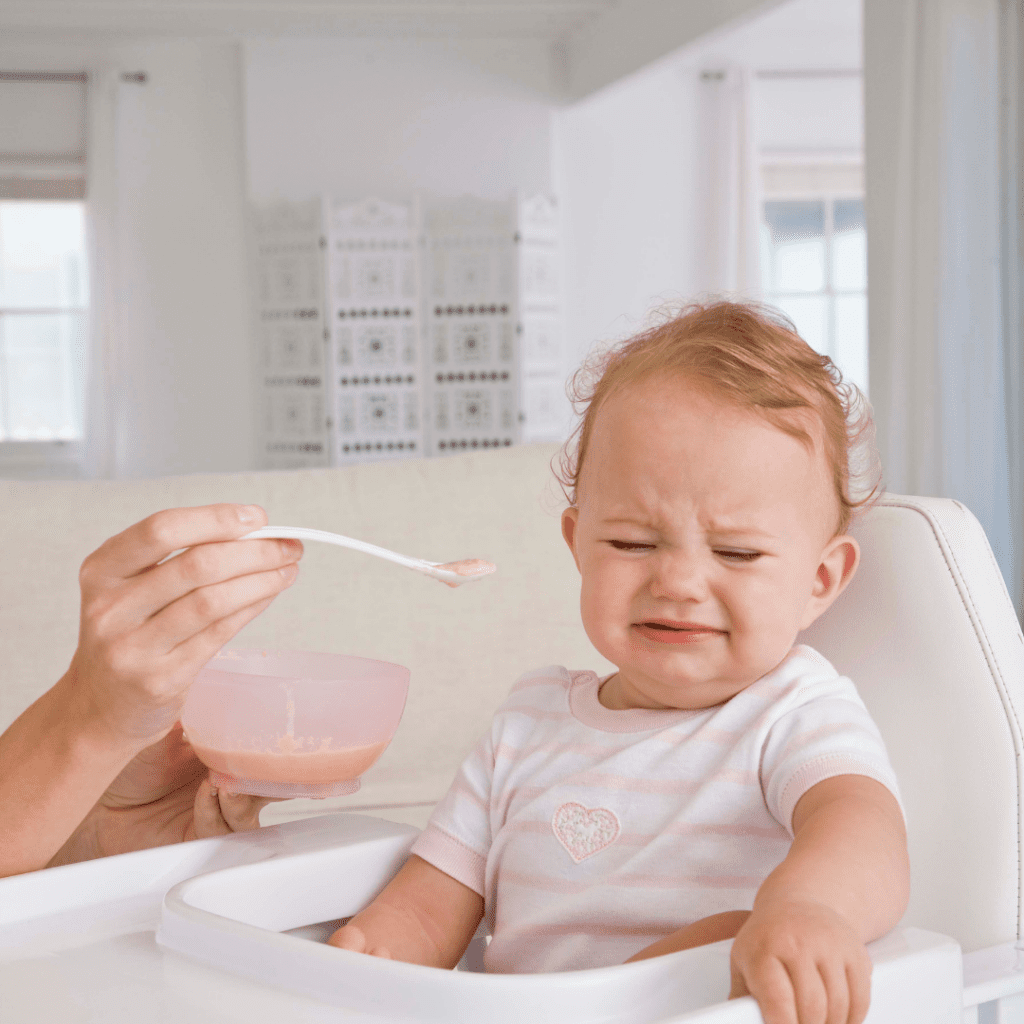 baby spitting food out