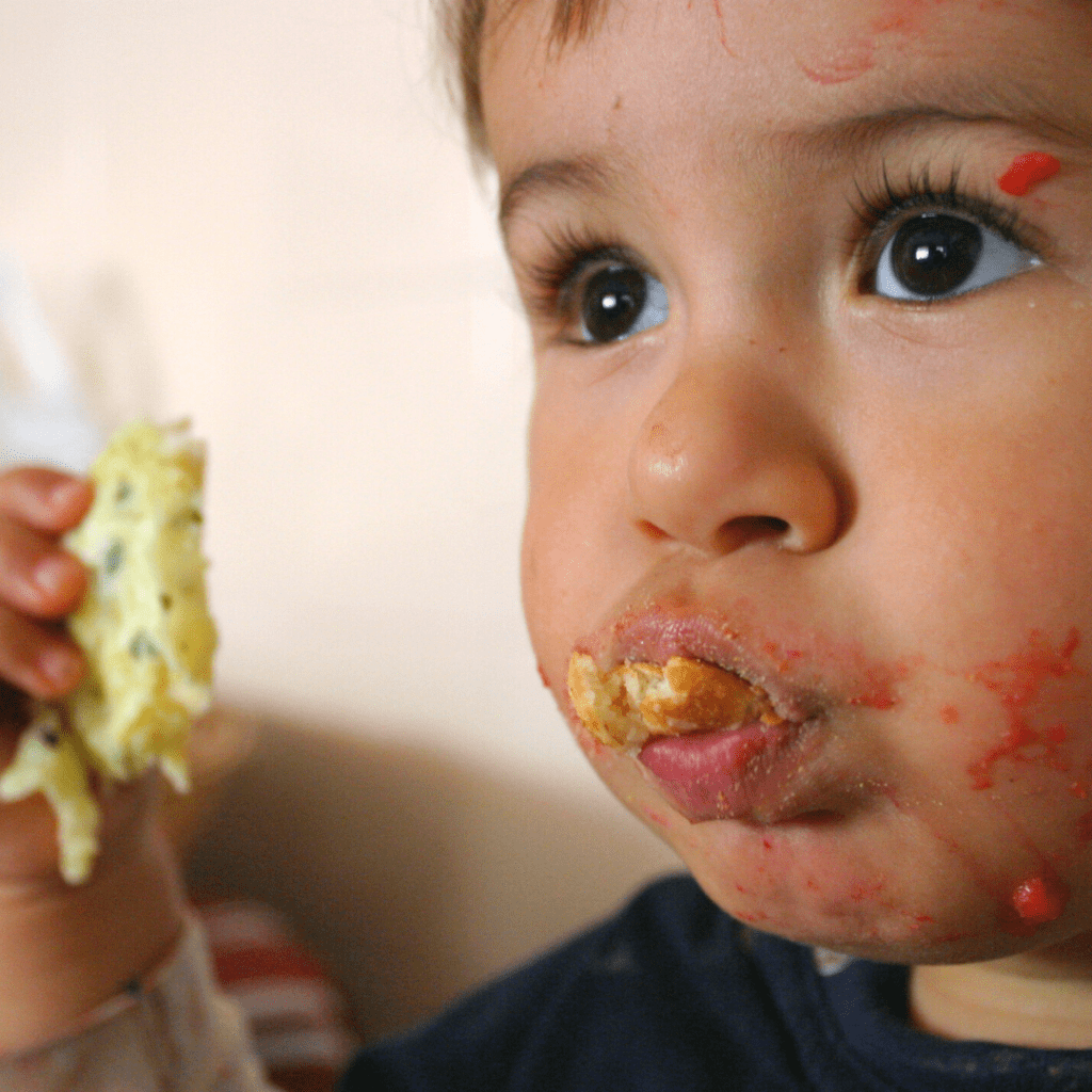 mouth stuffing and baby spits out food