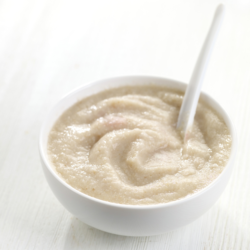 purées at 4 months to help babies sleep; bowl of beige-colored rice cereal