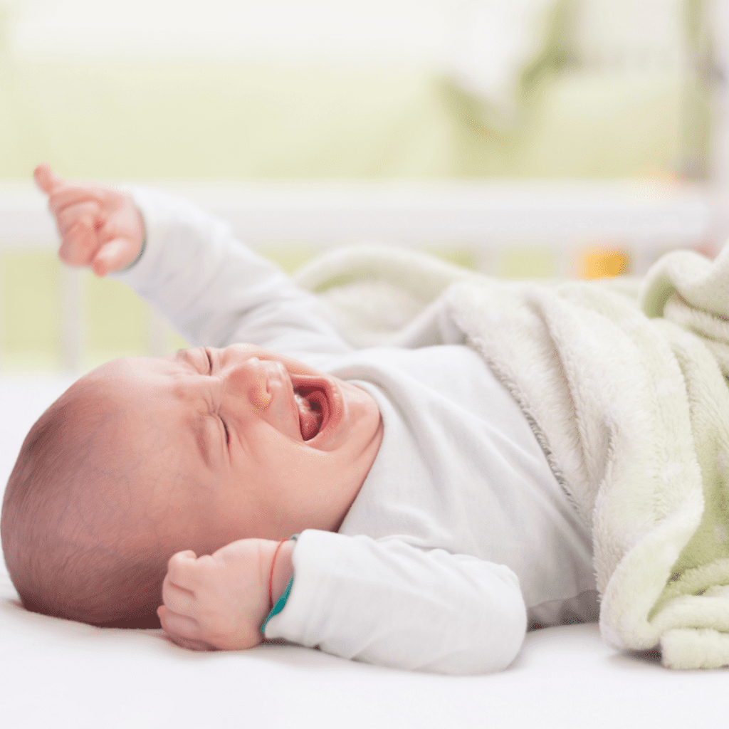 baby constipated after starting solids; baby crying in crib