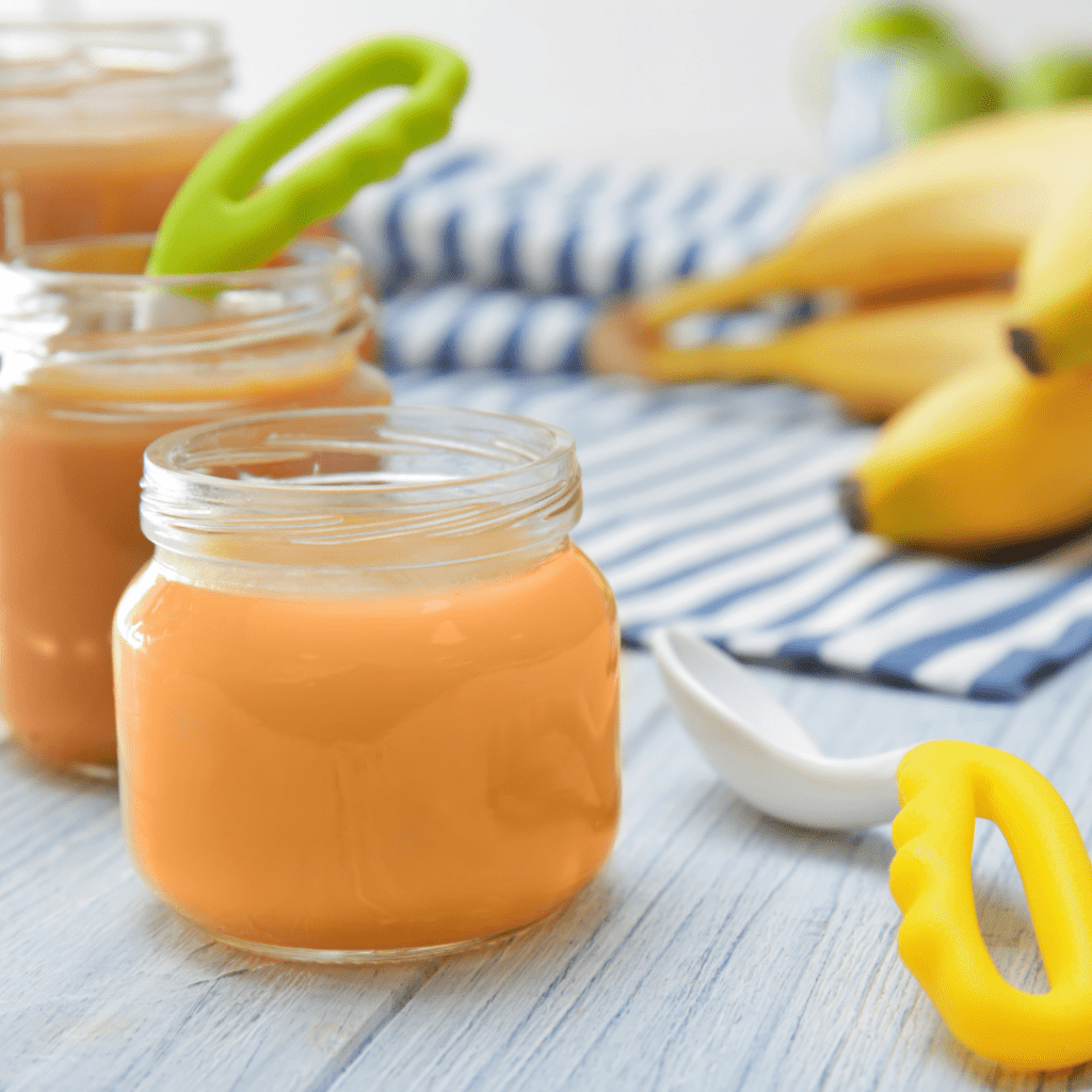 research suggests waiting until 6 months for baby's first foods is best; jar of pureed infant food
