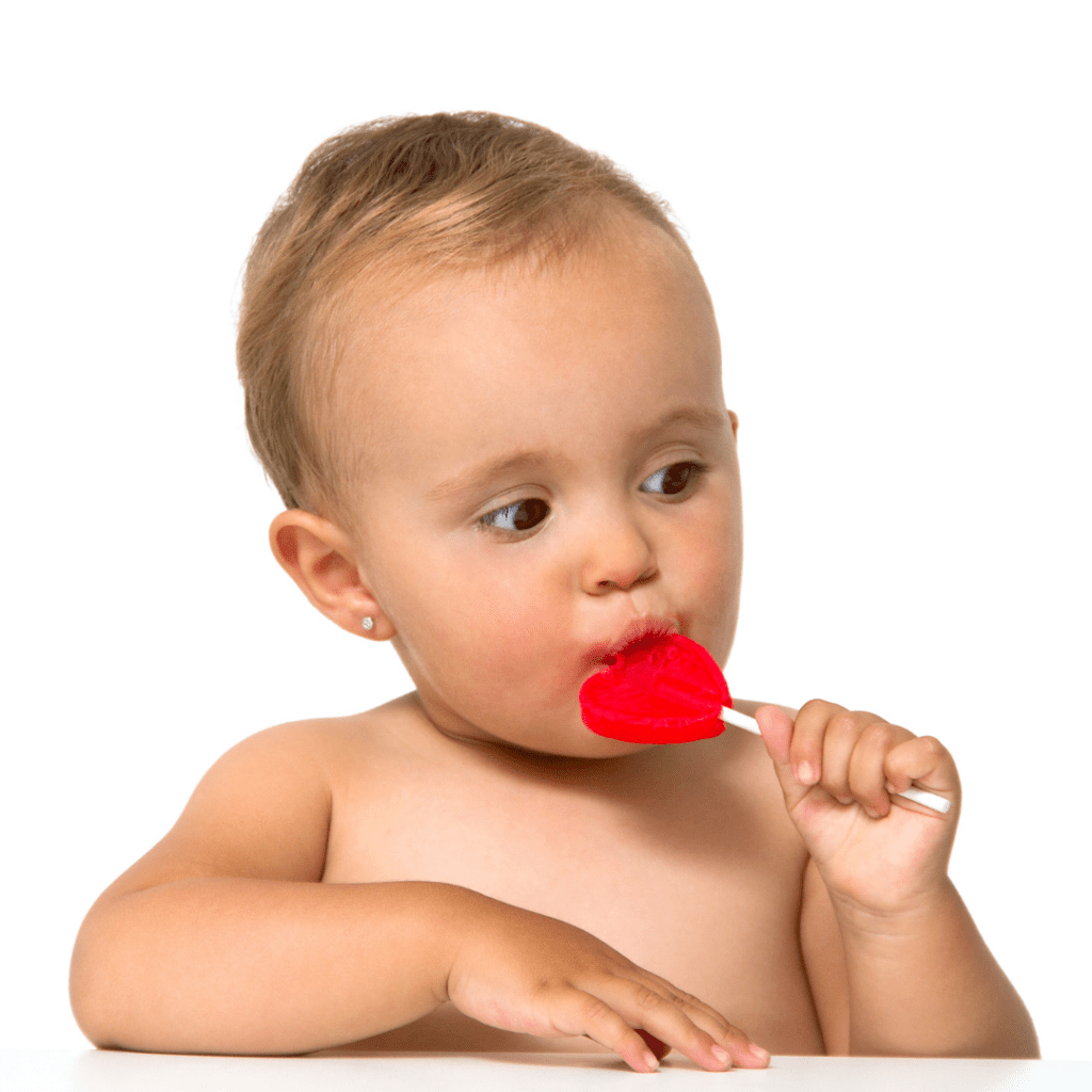 what are unhealthy fats for kids; image of baby eating candy