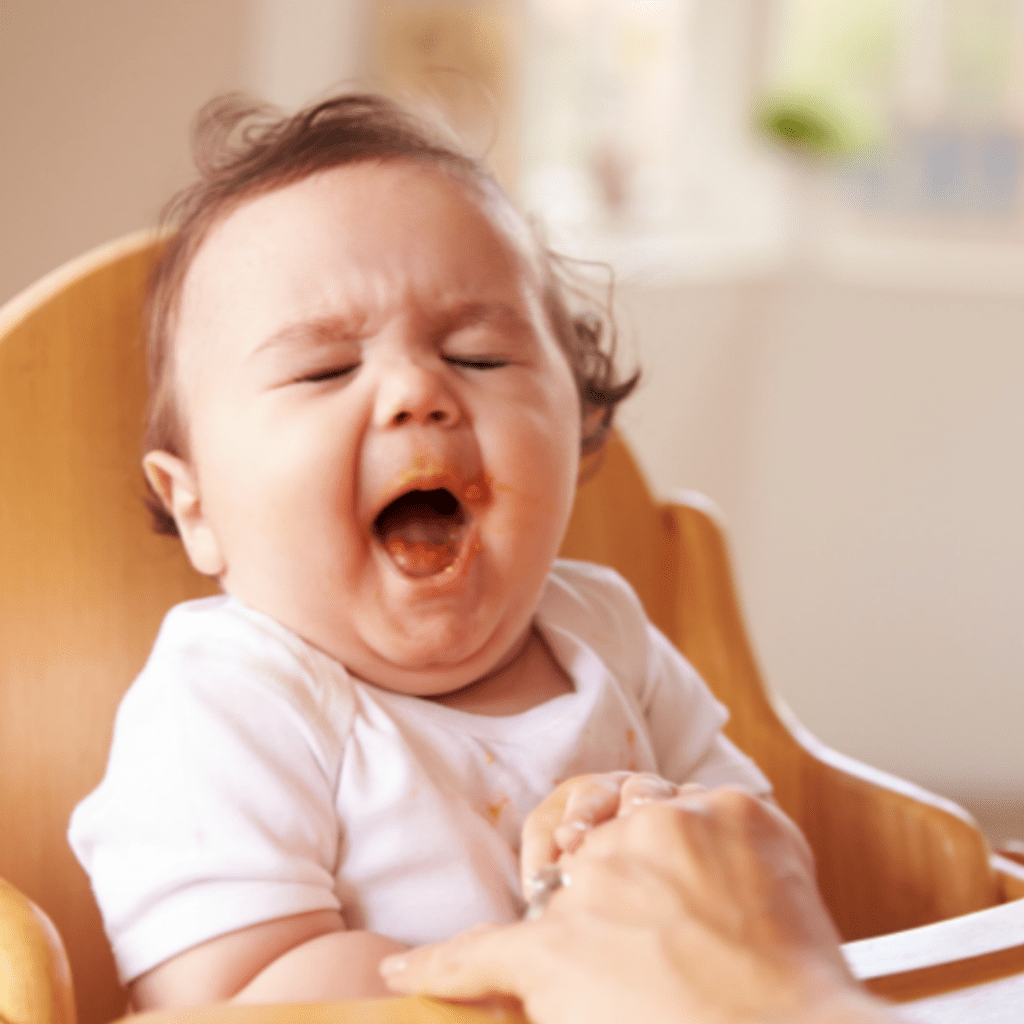 remain calm during a baby gag, they have control; image of baby gagging during their weaning journey