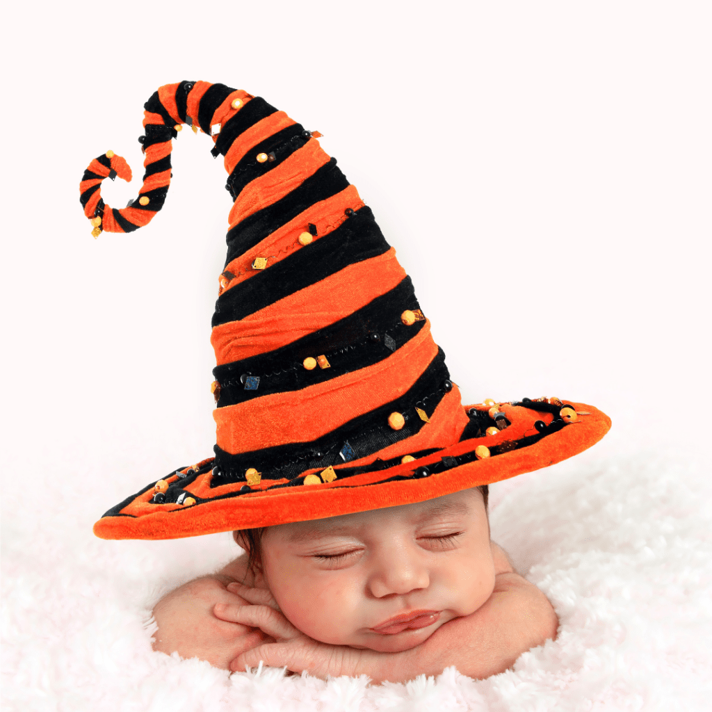 Baby with a witch hat on.