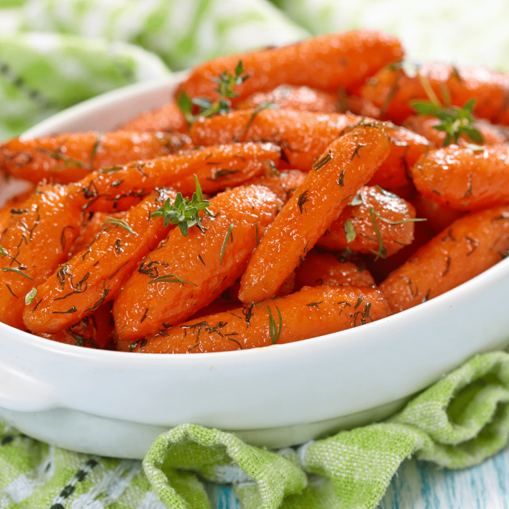 Cooked carrots in a bowl.