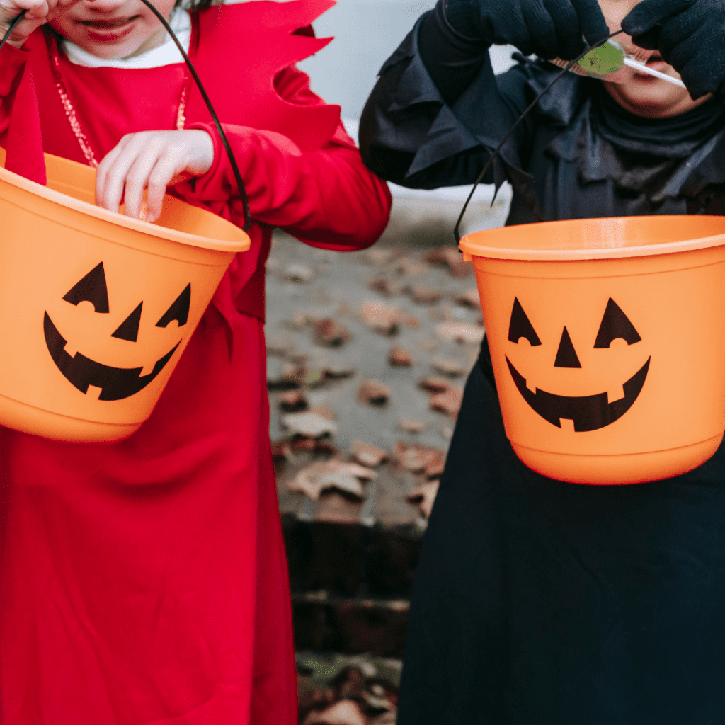 Managing a healthy Halloween for your toddler or preschooler. Two kids trick-or-treating.