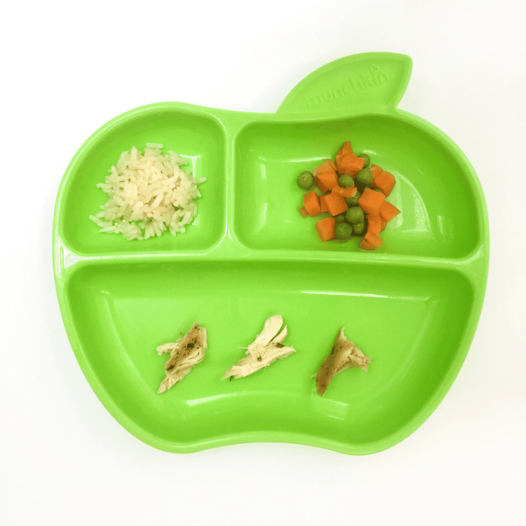 Chicken, rice, peas, and carrots served for baby led weaning.
