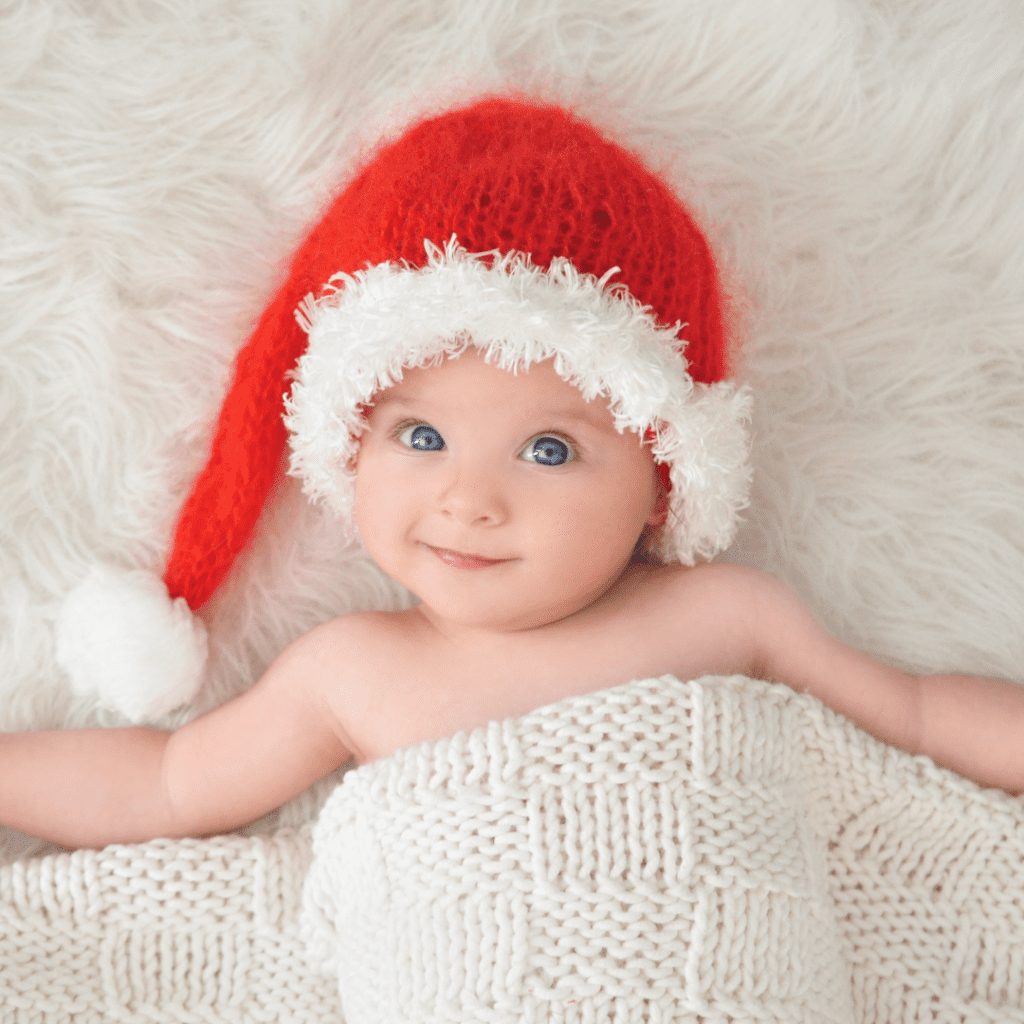 Baby in a santa hat; 2023 holiday gift guide.