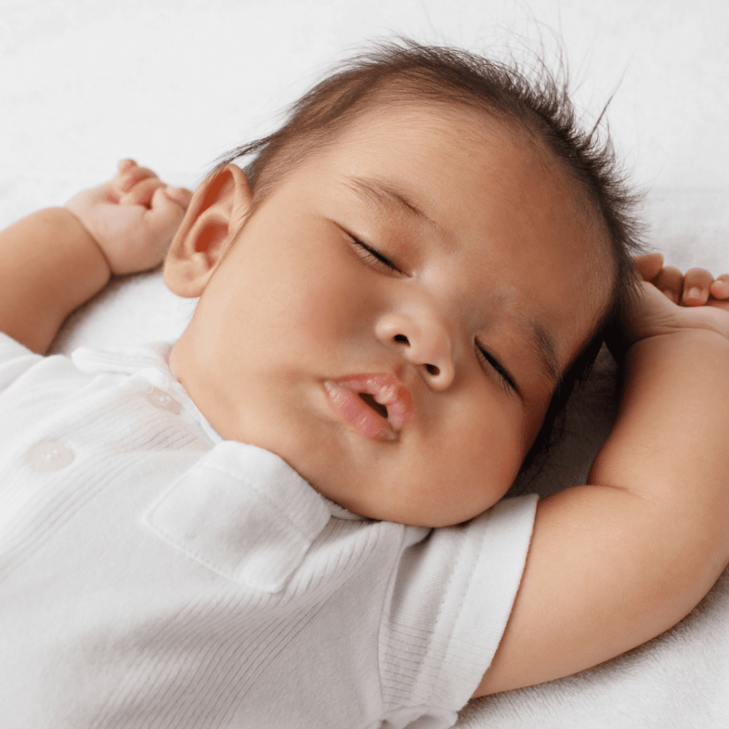 When and how to night wean your baby; baby sleeping peacefully.