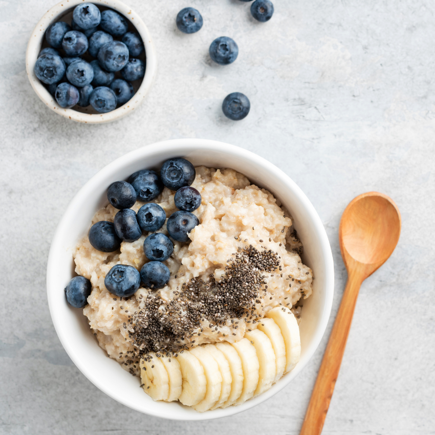 Oatmeal bowl topped with blueberries, banana, and chia seeds.