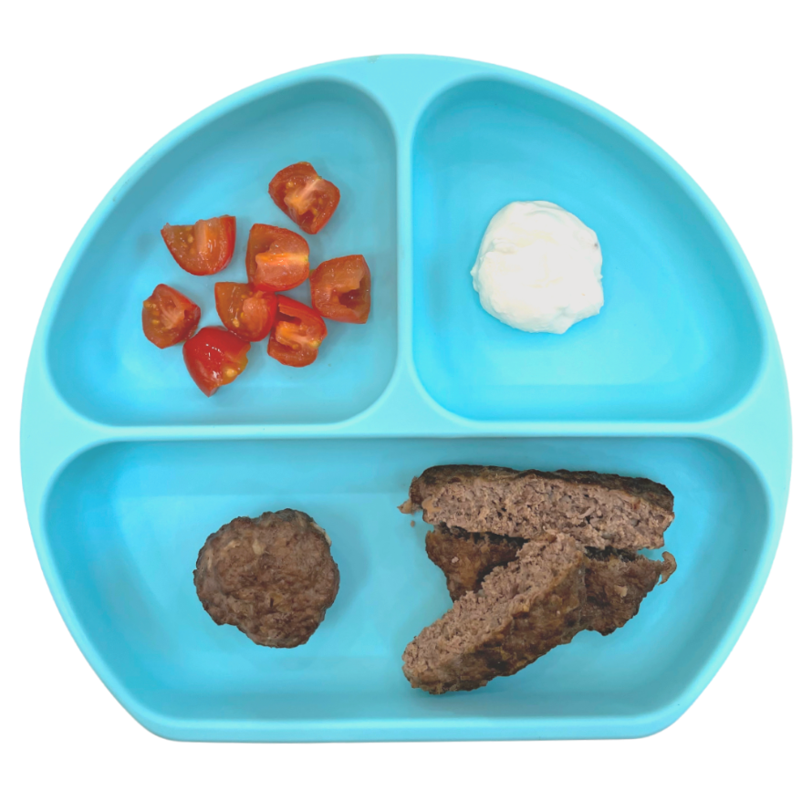 One way to prepare meat as a baby food is to serve it as a meatball or burger cut into strips, with quartered baby tomatoes and yogurt for dipping.