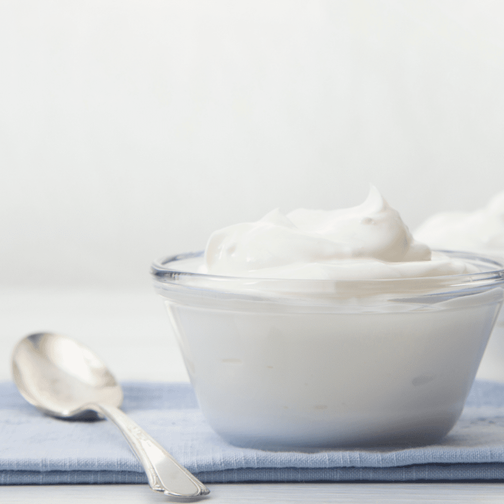 Choosing the best yogurt for babies; yogurt in a bowl with a spoon.
