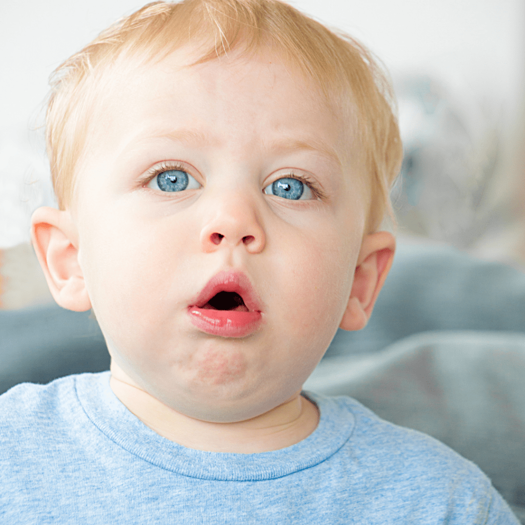 Baby's mouth open while coughing or gagging.
