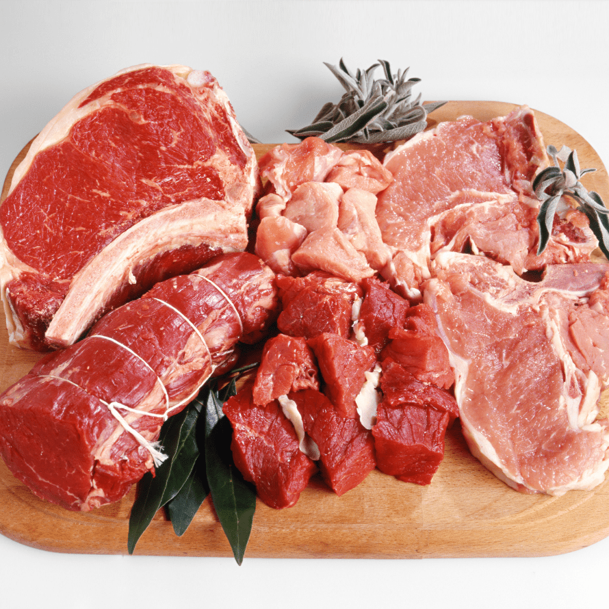 The best iron rich foods for babies include various forms of meat as shown here raw on a cutting board.