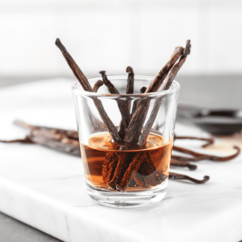 Soaking vanilla beans in a cup of alcohol.