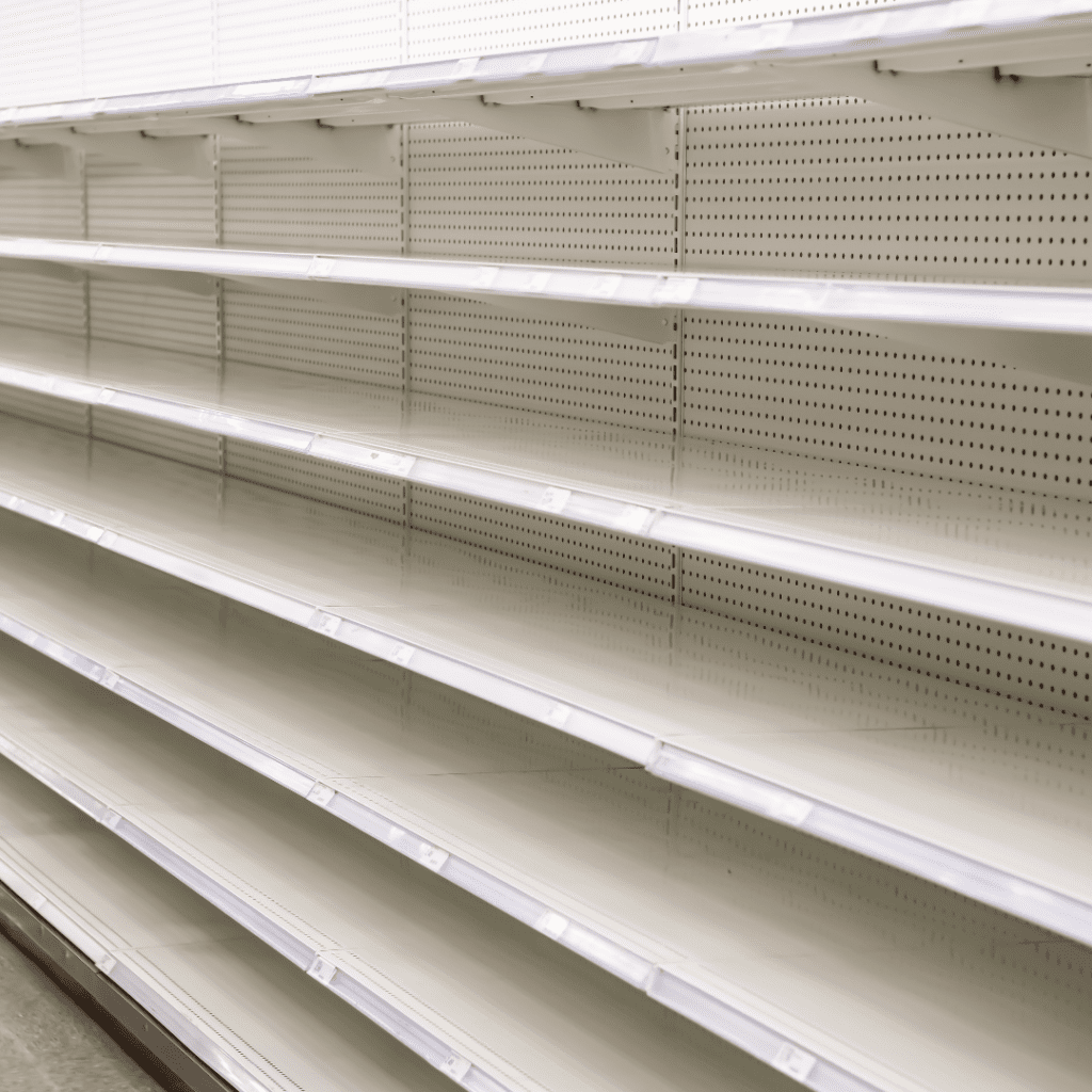 Empty grocery shelves symbolizing the baby formula shortage when many types of infant formula could not be found.