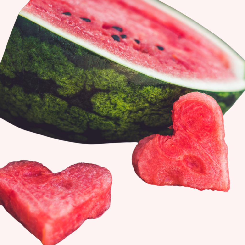 Ripe watermelon cut into two heart shapes.