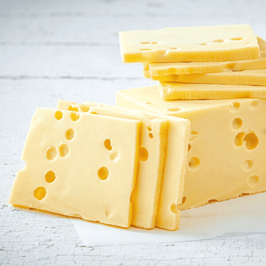 Stacked slices of swiss cheese.