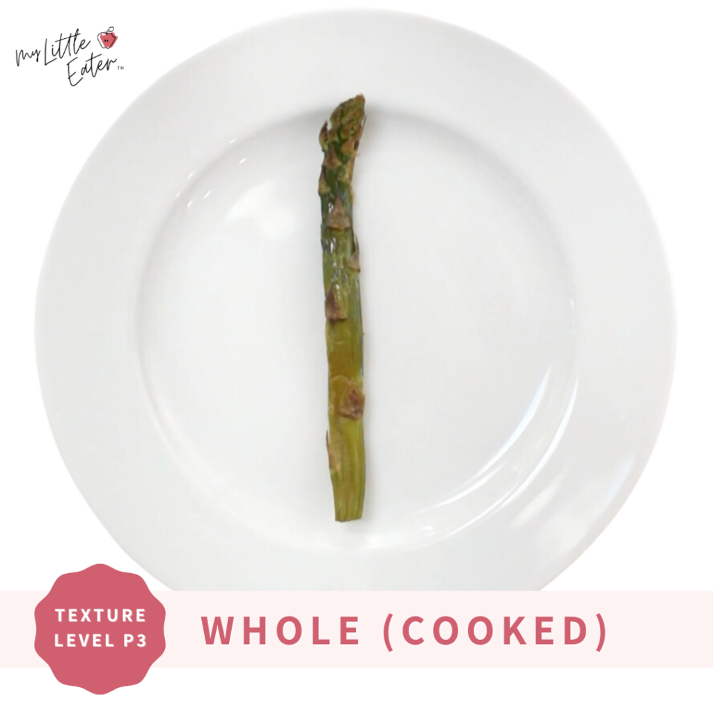 Serve asparagus as whole cooked asparagus spears, one is shown here on a plate.