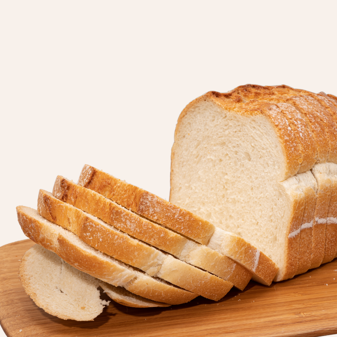 Sliced white bread on a cutting board.