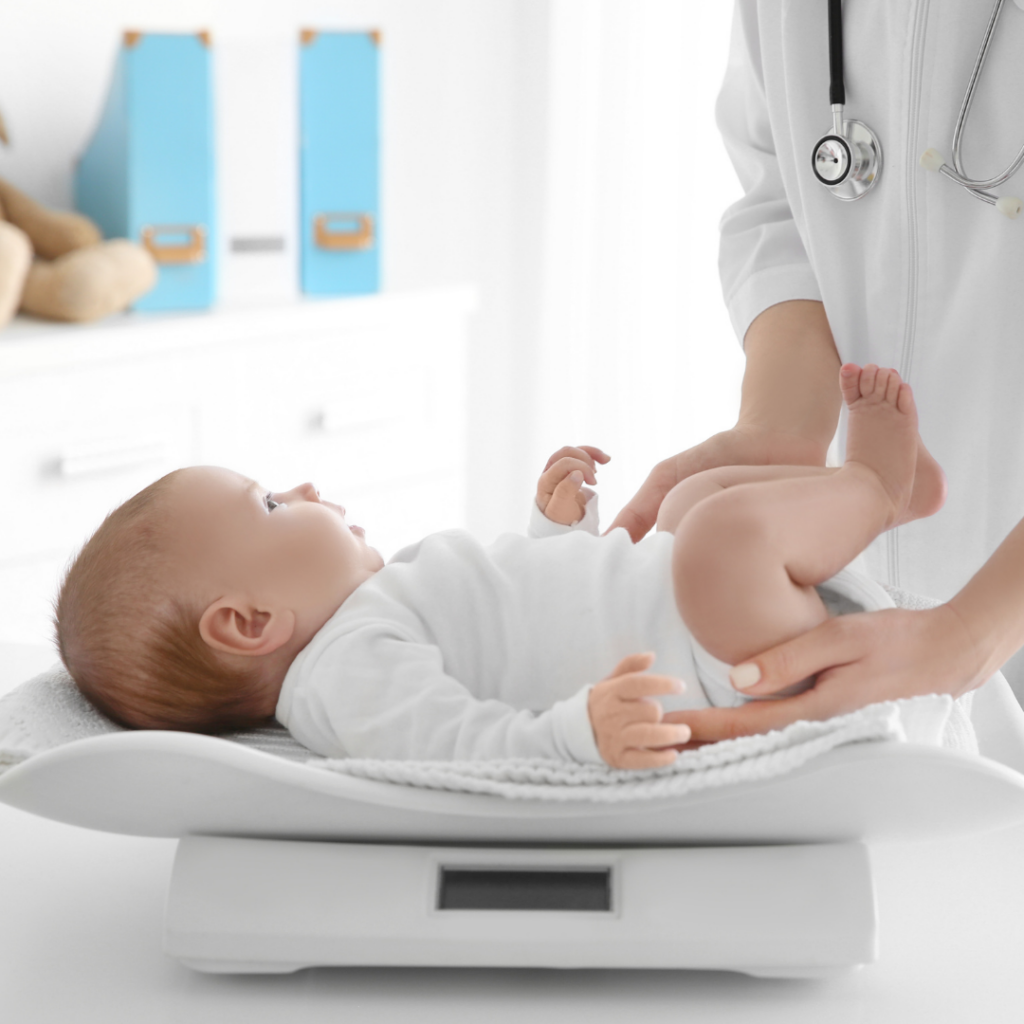 Babies grow at their own pace and this baby is being weighed at the doctor's office.