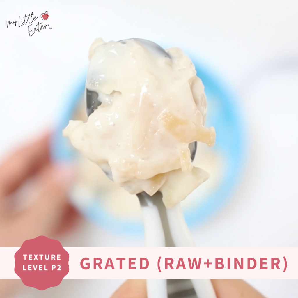 Grated apple mixed with plain yogurt to serve on a preloaded spoon for baby led weaning.