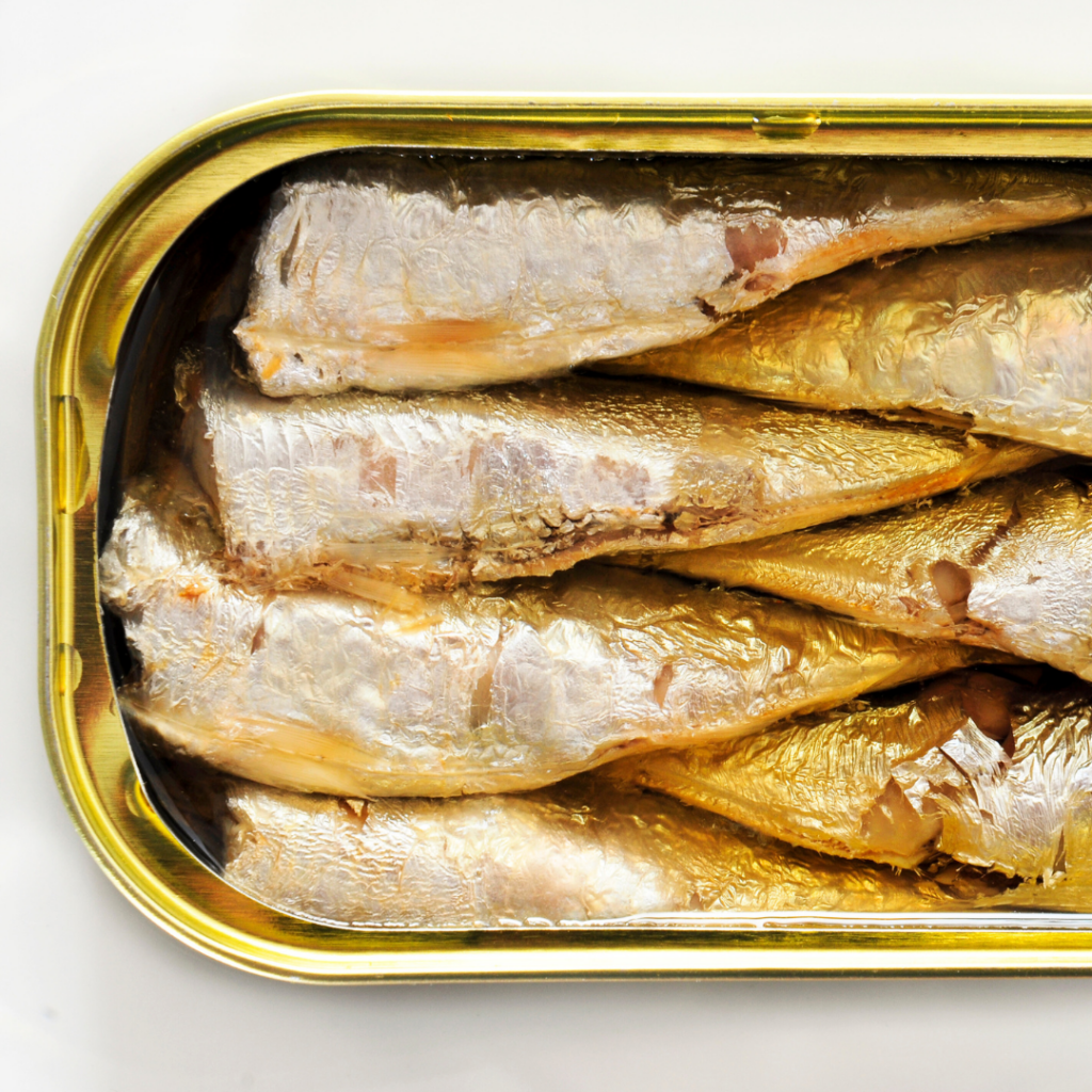 An open tin of sardines.