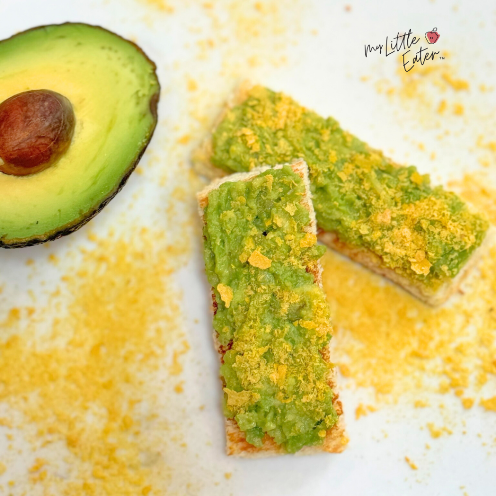 Avocado toast for babies with nutritional yeast on white bread.