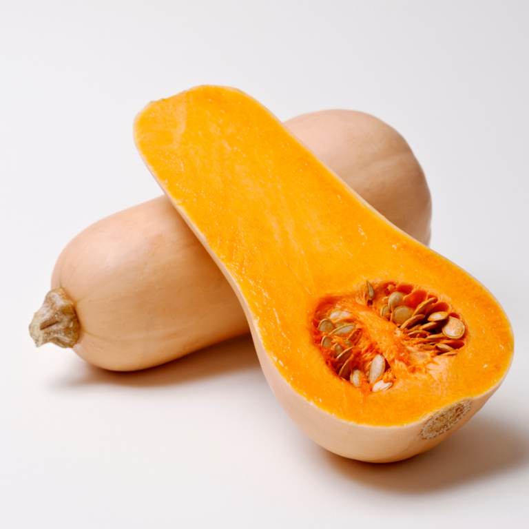 A ripe squash cut in half to prepare the butternut squash for baby.