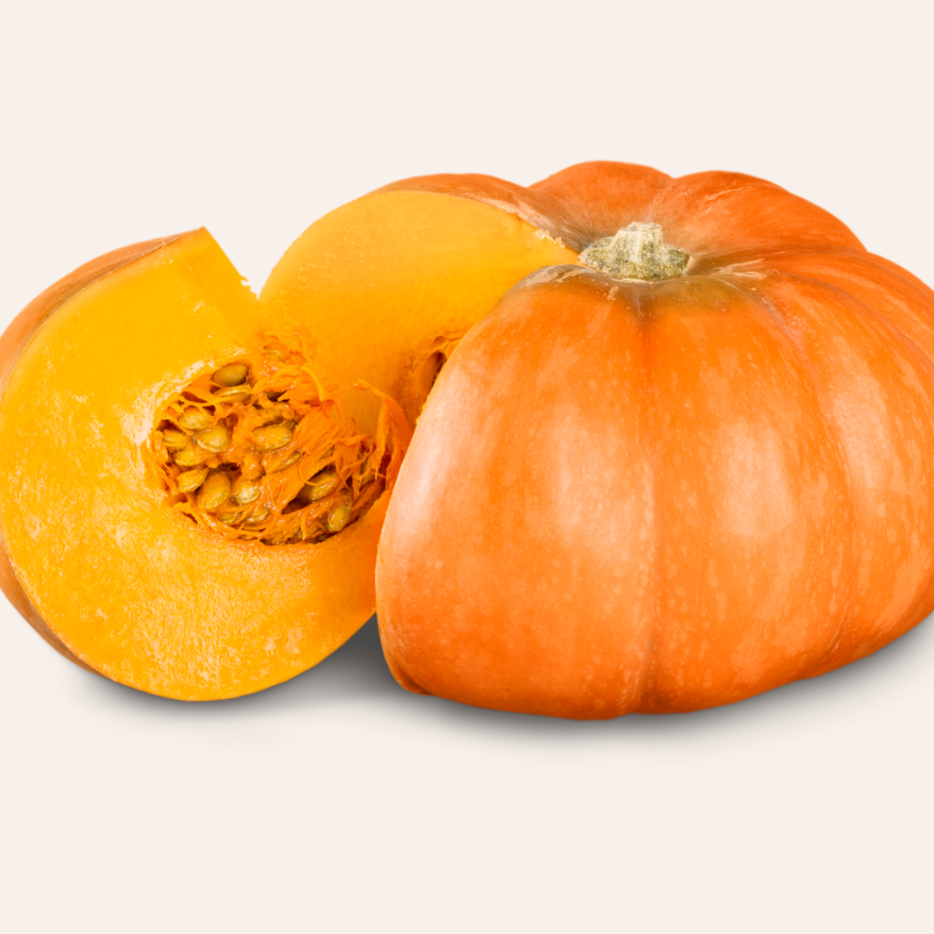 Pumpkin with a wedge cut out of it to reveal the pumpkin flesh and seeds.