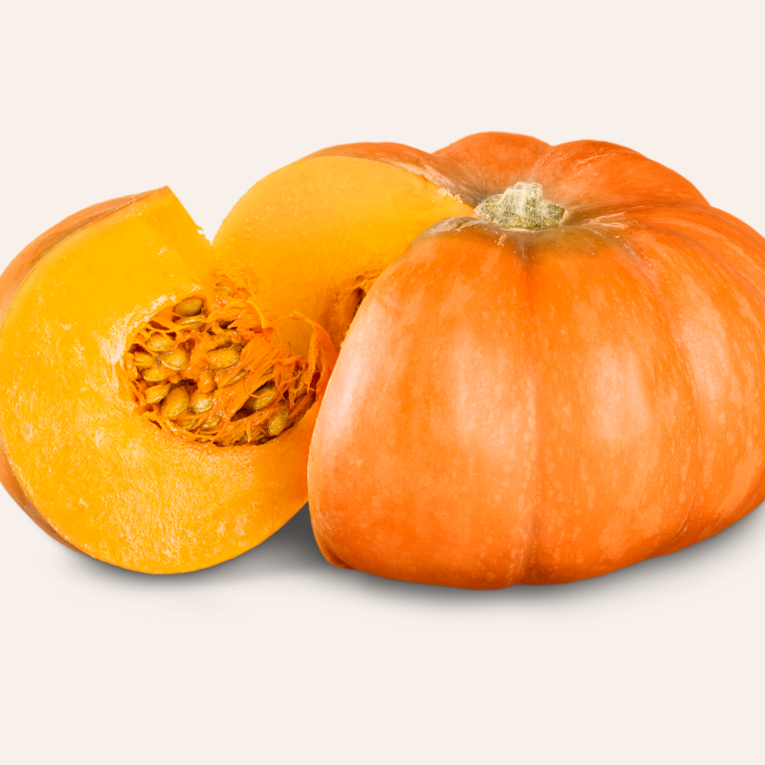 Pumpkin with a wedge cut out of it to reveal the pumpkin flesh and seeds.