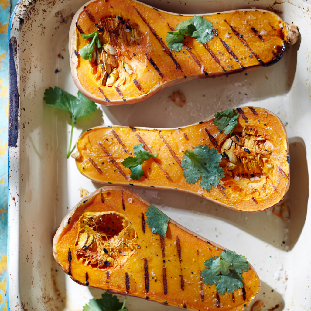 Butternut squash for baby that has been roasted on a baking sheet with oil and spices.