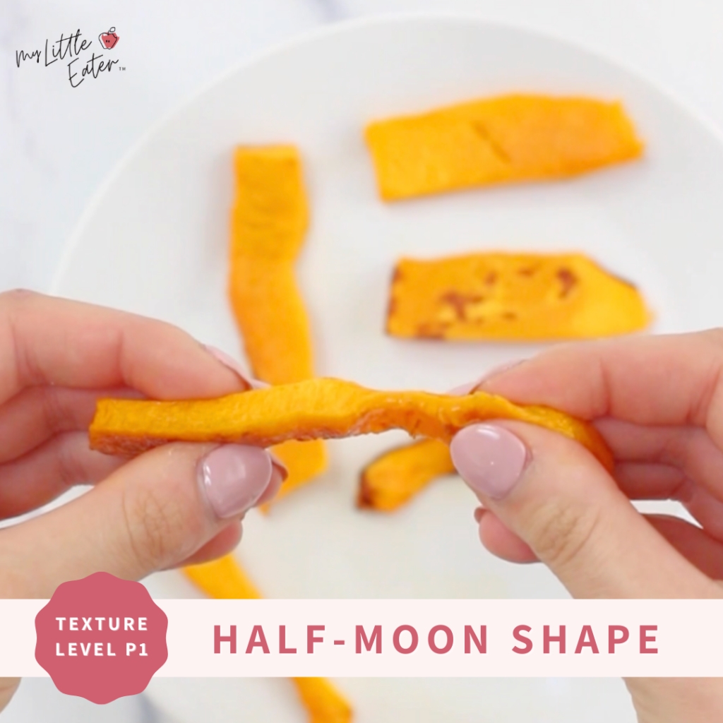 Cooked butternut squash baby food served in a half moon shape for baby led weaning.