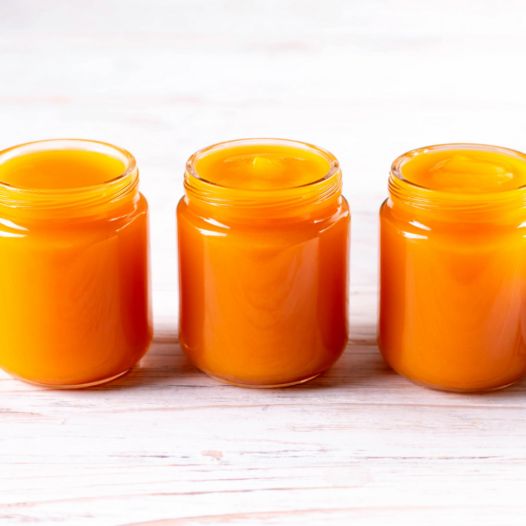 Pumpkin puree stored in glass baby food jars to serve pumpkin for baby later.