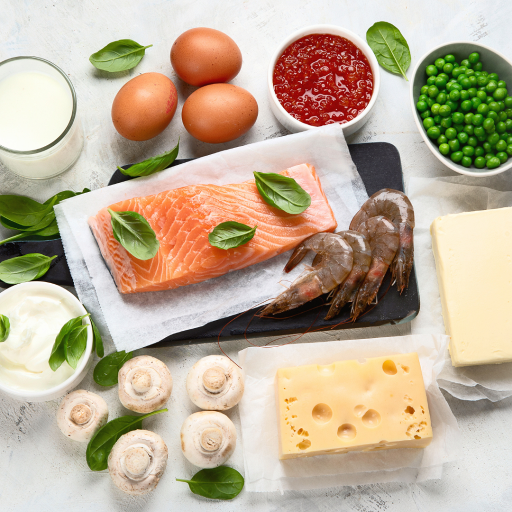 Foods rich in vitamin D with various health benefits to keep kids healthy, including: cheese, salmon (oily fish), shrimp, and eggs.