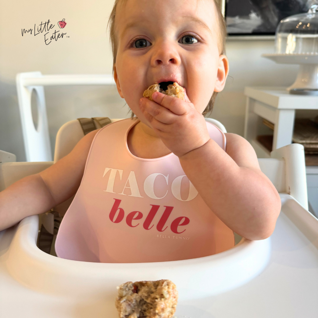 Baby loves eating turkey meatballs in her high chair.