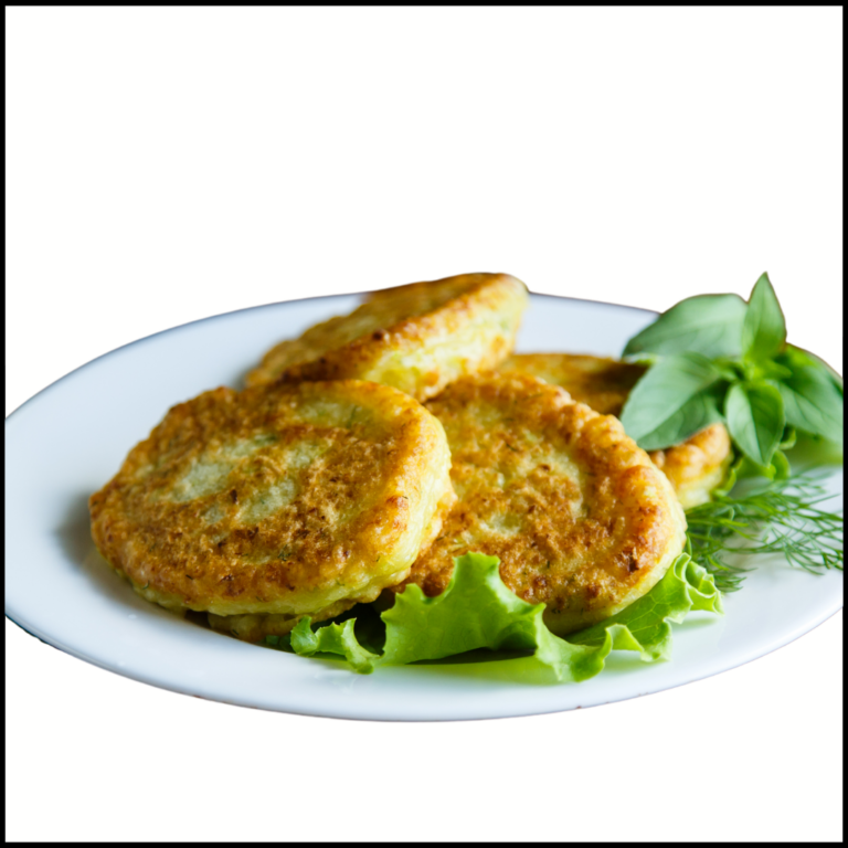 Cabbage pancakes for babies on a white plate with decorative lettuce.