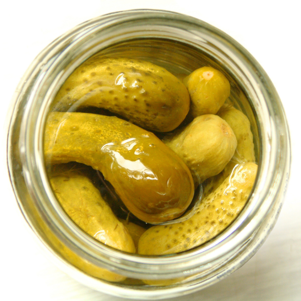 An opened jar of pickles with too much salt for babies to consume regularly.