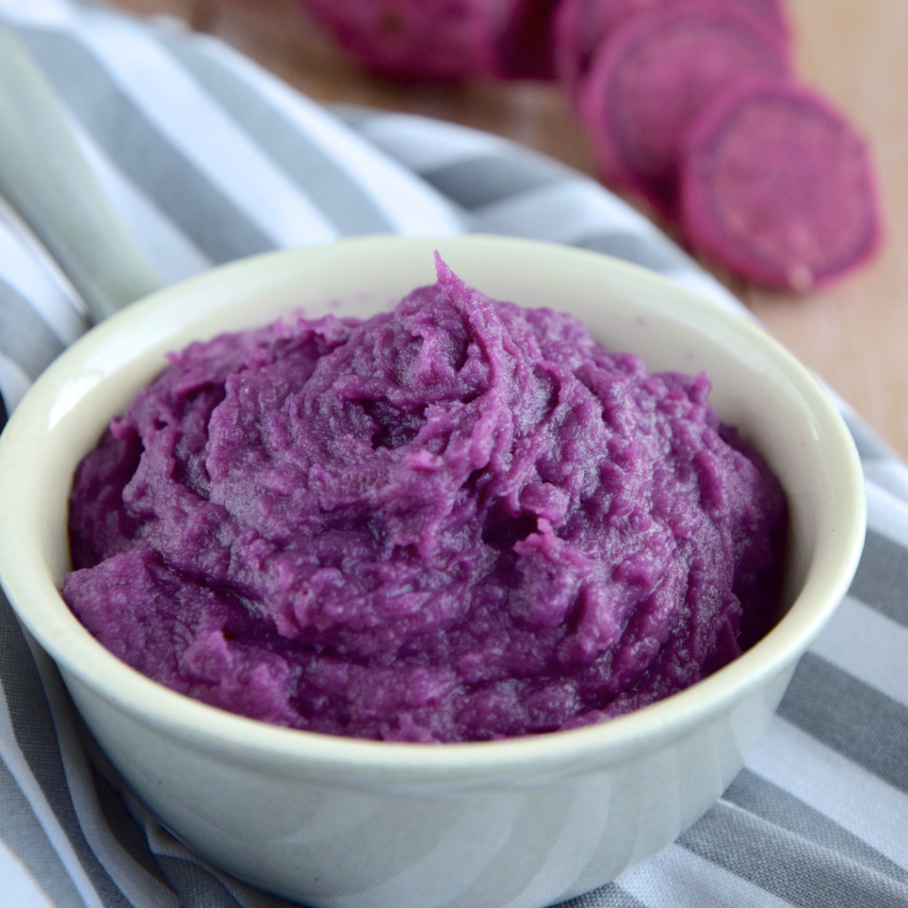 Pureed purple carrot to use for finger painting as one of many edible sensory play ideas.